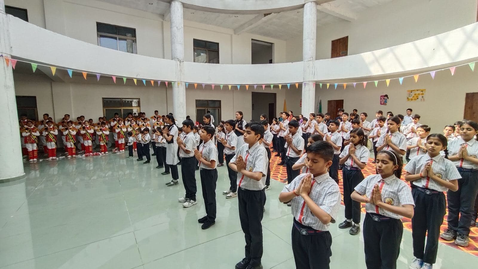 Students at morning assembly in the school atrium