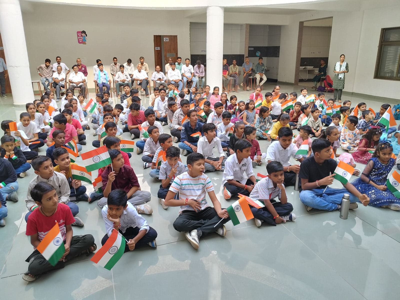 Students holding flags on Independence Day